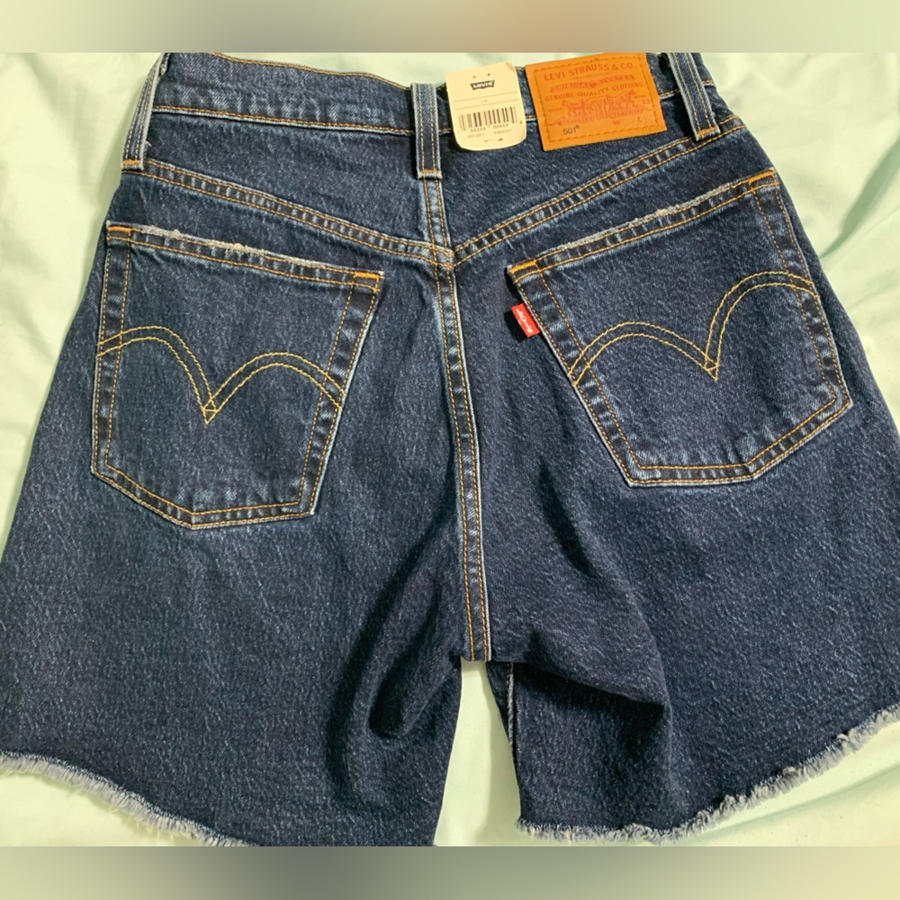 New with tags. Never worn, high rise mid thigh  Levi 501 women’s shorts size 24.